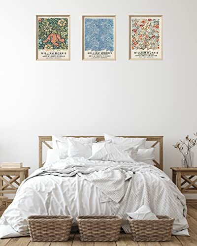 Bedroom with wooden bed, white bedding, and three William Morris prints above.