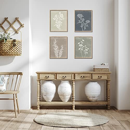 Boho-style entryway with wooden console, large vases, wall art, and wicker basket.