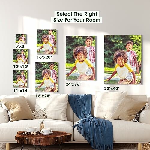 Various sizes of canvas prints displayed above a couch.