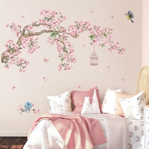 Bedroom with cherry blossom wall art and cozy bedding.