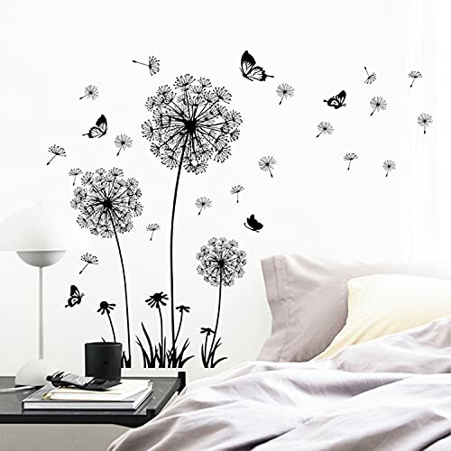 Bedroom with dandelion and butterfly wall decals above bed.