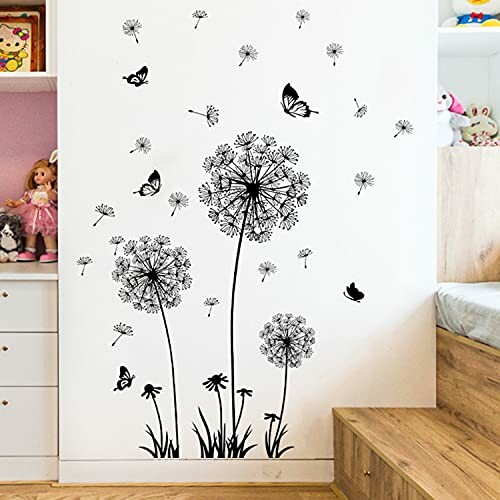 Wall with black dandelion and butterfly decals in a bedroom.