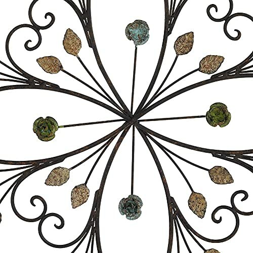 Decorative metal wall art with floral and leaf design.