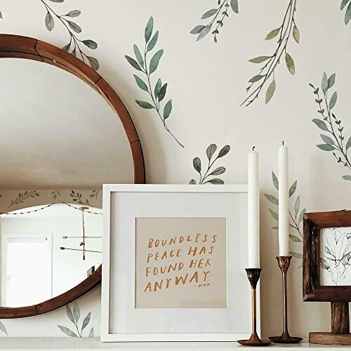 Decorative wall with mirror, framed quote, and candles