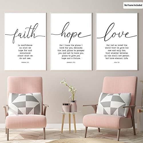 Three inspirational wall art prints above pink chairs.