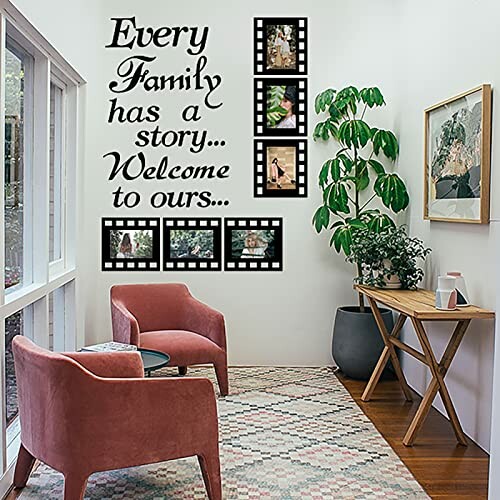 Living room with wall decal 'Every Family has a story... Welcome to ours...' and photo frames.