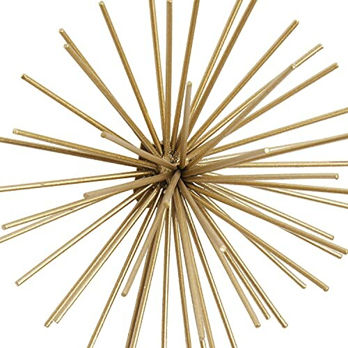 Gold spiky decorative sculpture with rods radiating outward.