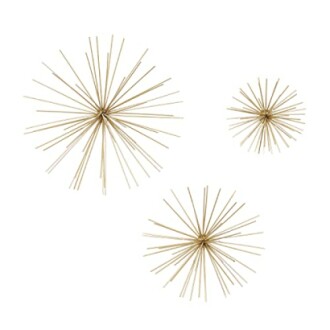 Set of three gold starburst wall sculptures.