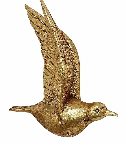 Golden bird wall sculpture with wings spread