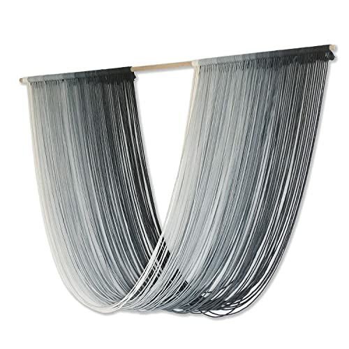 Gray ombre string curtain hanging on a rod.