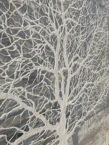 Close-up of intricate white tree branches on a textured surface