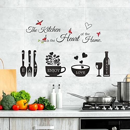 Kitchen wall with decorative eatery-themed stickers and quote.