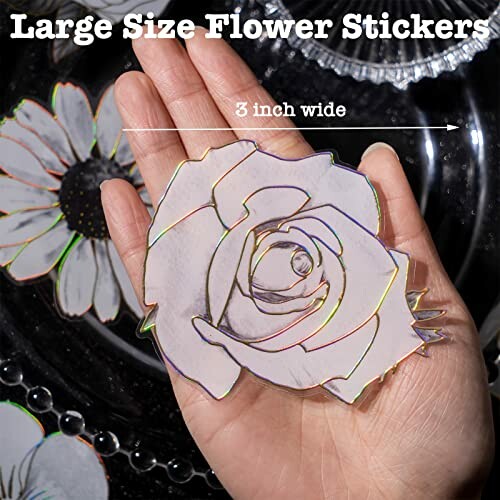 Hand holding a large rose-shaped flower sticker, 3 inches wide.