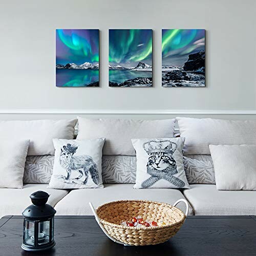 Living room with sofa, decorative pillows, and wall art of northern lights.