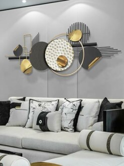 Modern abstract wall art above a stylish sofa with cushions