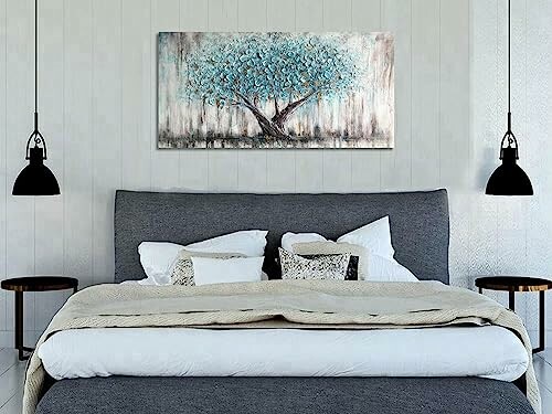 Modern bedroom with abstract tree painting above bed.