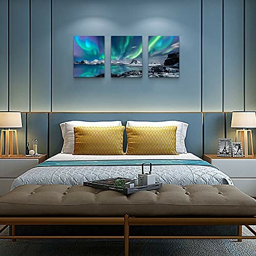 Contemporary bedroom with aurora borealis wall art and stylish decor.