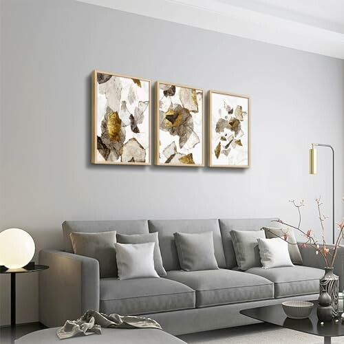 Contemporary living room with gray sofa and abstract wall art.