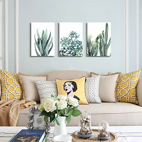 Stylish living room with cactus paintings and decorative pillows