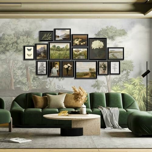 Living room with green sofas and a gallery wall of framed art.
