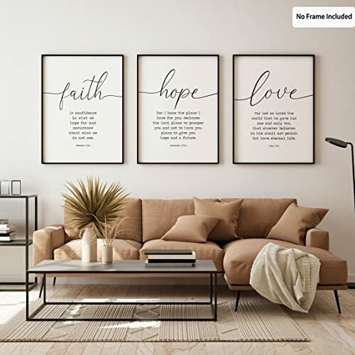 Living room with three framed inspirational word posters above a beige sofa.