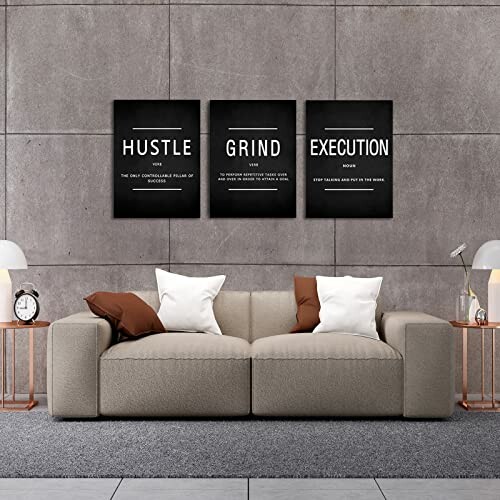 Living room with a sofa and motivational wall art above it.