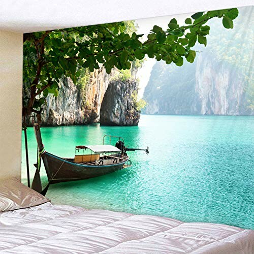 Peaceful tropical scene with a boat on turquoise water and limestone cliffs.